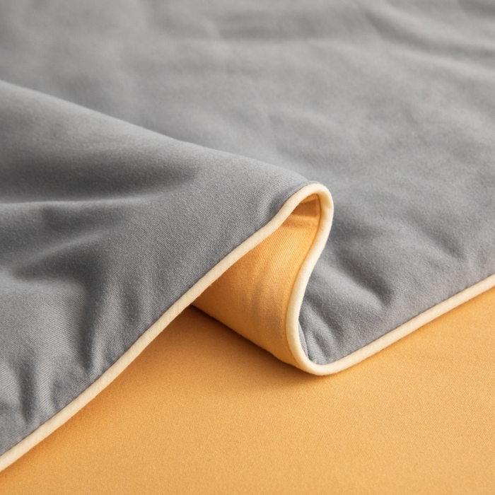 91家纺网 家纺一手货源 找家纺 吾诺家居 2024新款针织棉双拼色大豆夏被 岩灰-杏黄