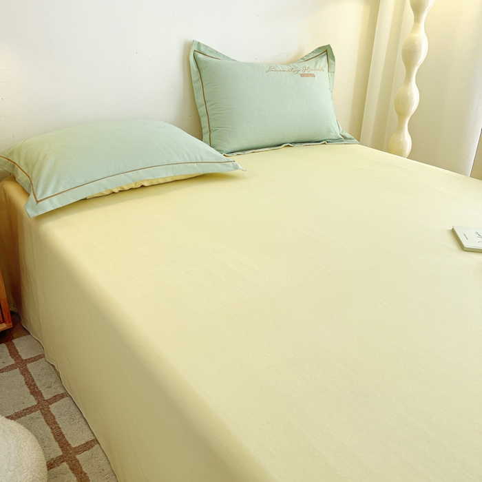 91家纺网 家纺一手货源 找家纺 菲梵家纺 2025新款纯色双拼全棉加厚磨毛刺绣款套单床单（自然光场景） 气质黄