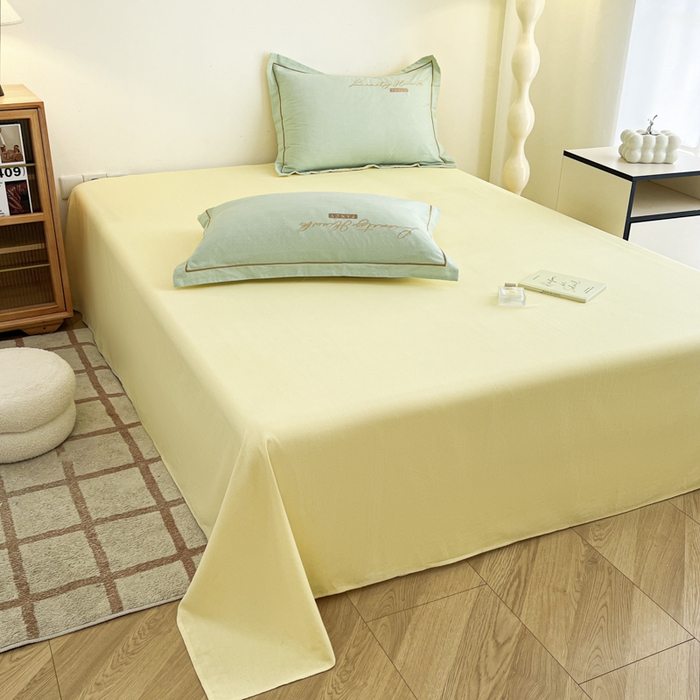 91家纺网 家纺一手货源 找家纺 菲梵家纺 2025新款纯色双拼全棉加厚磨毛刺绣款套单床单（自然光场景） 气质黄