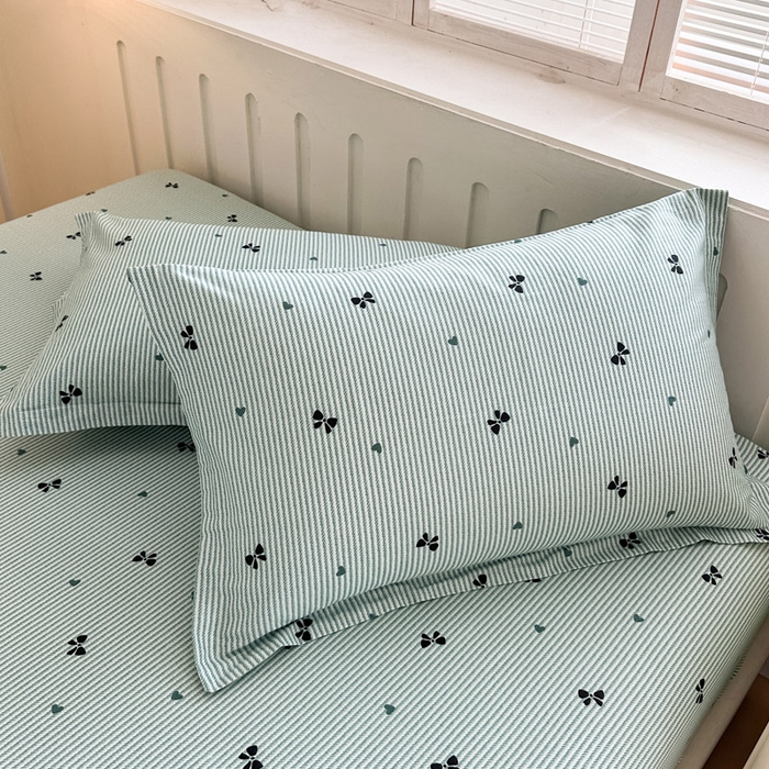 91家纺网 家纺一手货源 找家纺 绵庭家纺 2025新款全棉印花单枕套系列 绿底蝴蝶结