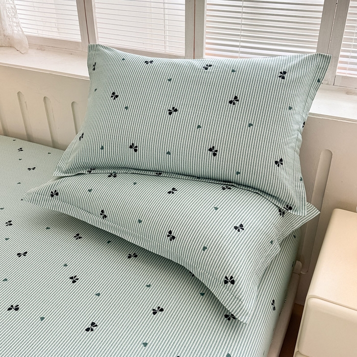 91家纺网 家纺一手货源 找家纺 绵庭家纺 2025新款全棉印花单枕套系列 绿底蝴蝶结