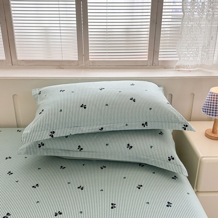 91家纺网 家纺一手货源 找家纺 绵庭家纺 2025新款全棉印花单枕套系列 绿底蝴蝶结