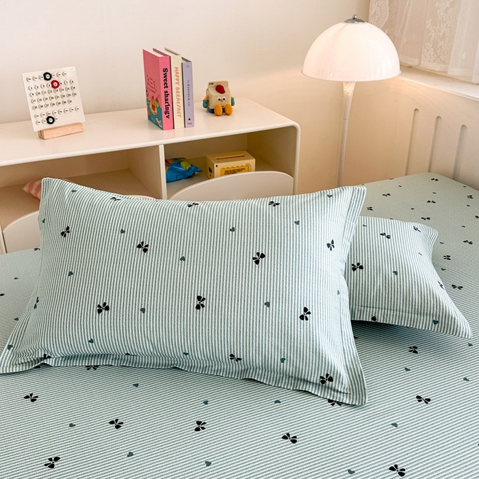 91家纺网 家纺一手货源 找家纺 绵庭家纺 2025新款全棉印花单枕套系列 绿底蝴蝶结