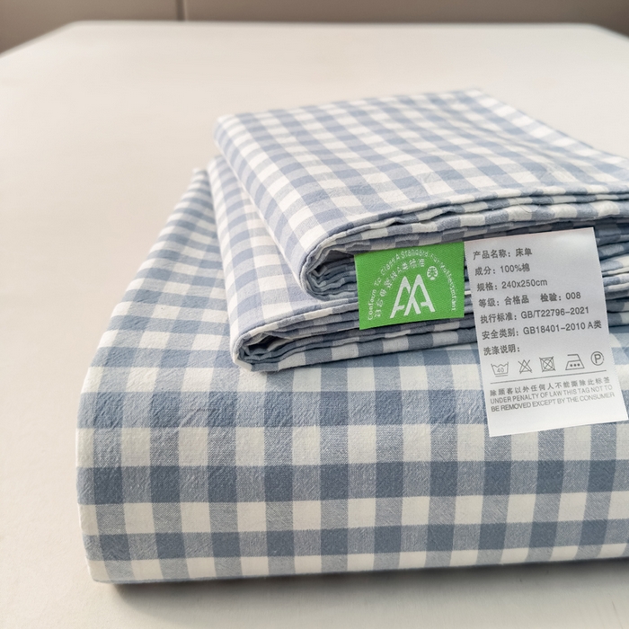 91家纺网 家纺一手货源 找家纺 柠萌家居 2025新款无印风全棉色织A类母婴级纯棉水洗棉床单 浅蓝小格