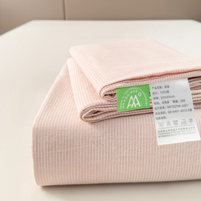 91家纺网 家纺一手货源 找家纺 柠萌家居 2025新款无印风全棉色织A类母婴级纯棉水洗棉床单 粉极细条