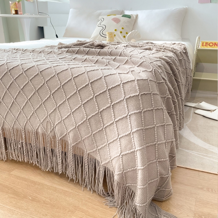 91家纺网 家纺一手货源 找家纺 朴尔家纺-毛巾被 2025新款菱形格条纹流苏手工针织毯 浅咖色