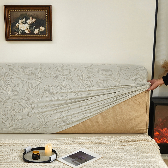 91家纺网 家纺一手货源 找家纺 逐日沙发套 2025新款提花绒床头罩-叶沙 浅灰