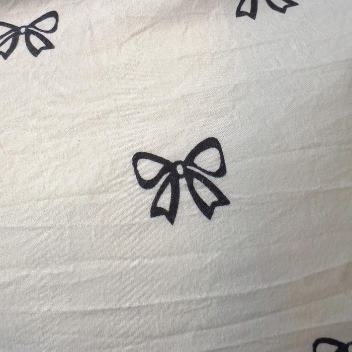 91家纺网 家纺一手货源 找家纺 仟人梦 2025新款水洗棉印花四件套 黑色蝴蝶结