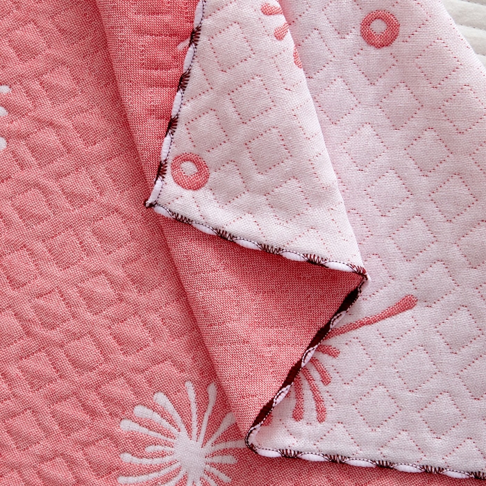 91家纺网 家纺一手货源 找家纺 朴尔家纺-毛巾被 2025新款蜂窝透气提花锁边立体枕巾 蒲公英飞-粉