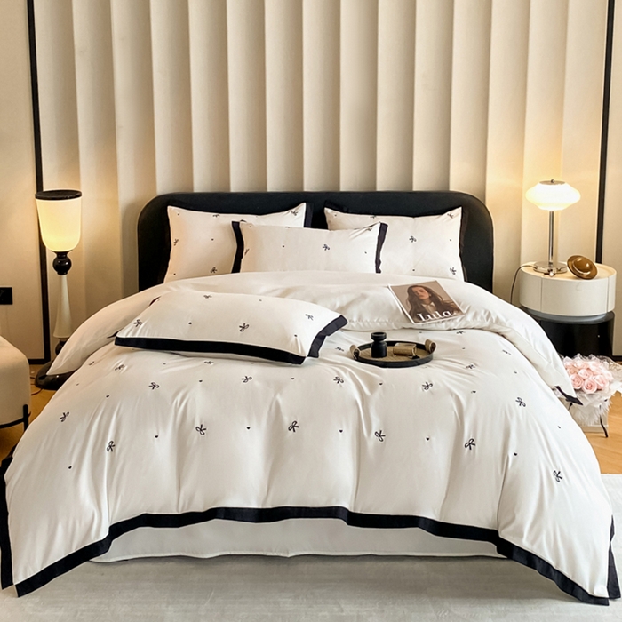 91家纺网 家纺一手货源 找家纺 米彩家纺 2025新款水洗磨毛四件套-蝴蝶结爱心系列 蝴蝶结奶昔白