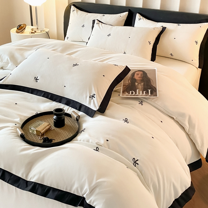 91家纺网 家纺一手货源 找家纺 米彩家纺 2025新款水洗磨毛四件套-蝴蝶结爱心系列 蝴蝶结奶昔白