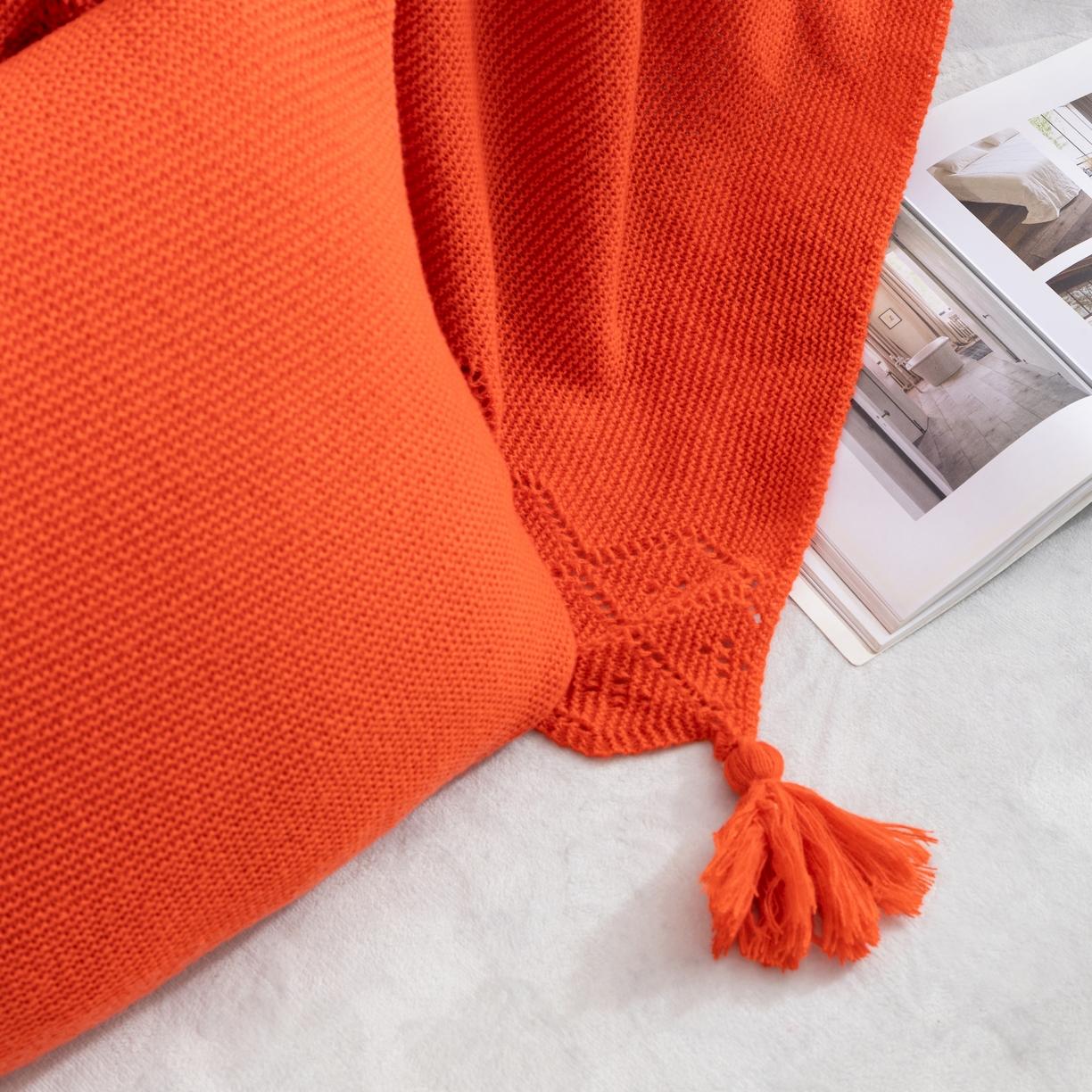 91家纺网 家纺一手货源 找家纺 肖恩毯业 2025新款鹿毛绒针织毯纯色素色螺纹镂空苏头北欧毛毯复古沙发毯休闲毯子 暗橘色