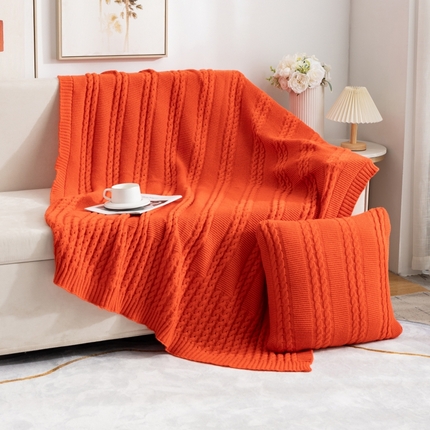 91家纺网 家纺一手货源 找家纺 肖恩毯业 2025新款鹿毛绒针织毯纯色素色螺纹镂空苏头北欧毛毯复古沙发毯休闲毯子 暗橘色