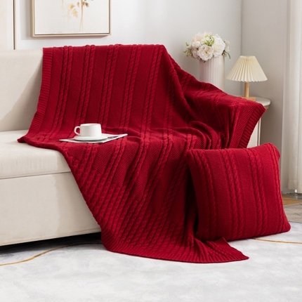 91家纺网 家纺一手货源 找家纺 肖恩毯业 2025新款鹿毛绒针织毯纯色素色螺纹镂空苏头北欧毛毯复古沙发毯休闲毯子 大红色