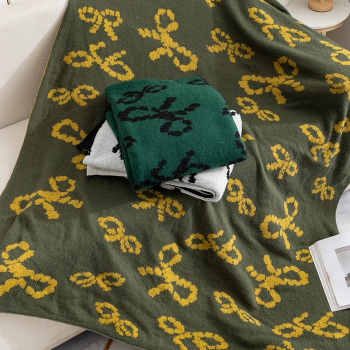 91家纺网 家纺一手货源 找家纺 （总）肖恩毯业 2025新款鹿毛绒针织毯蝴蝶结北欧毛毯复古沙发毯休闲毯子