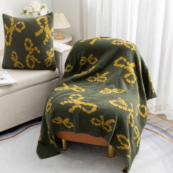 91家纺网 家纺一手货源 找家纺 （总）肖恩毯业 2025新款鹿毛绒针织毯蝴蝶结北欧毛毯复古沙发毯休闲毯子