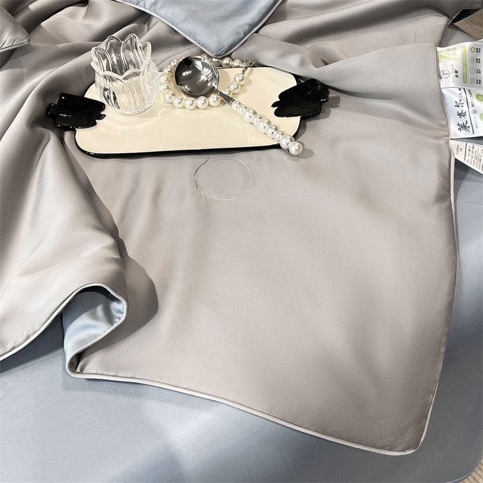 91家纺网 家纺一手货源 找家纺 雯豆天丝夏被纯色拼色A类莱赛尔凉感被子轻奢夏凉被子四件套 洛神珠-轻奢灰+雾霾蓝