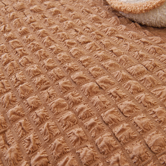 91家纺网 家纺一手货源 找家纺 启博家纺 2025新款泡泡纱功能款毛毛虫沙发套 驼色