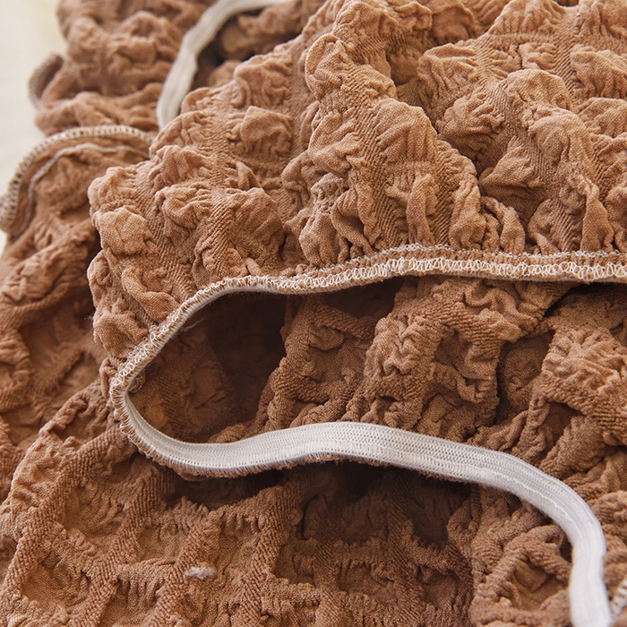 91家纺网 家纺一手货源 找家纺 启博家纺 2025新款泡泡纱功能款毛毛虫沙发套 驼色