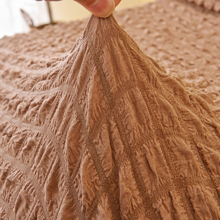 91家纺网 家纺一手货源 找家纺 启博家纺 2025新款泡泡纱功能款毛毛虫沙发套 驼色