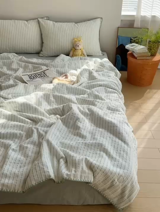 91家纺网 家纺一手货源 找家纺   曼町家居2025新款全棉水洗棉提花贝壳边夏被系列 流萤橙