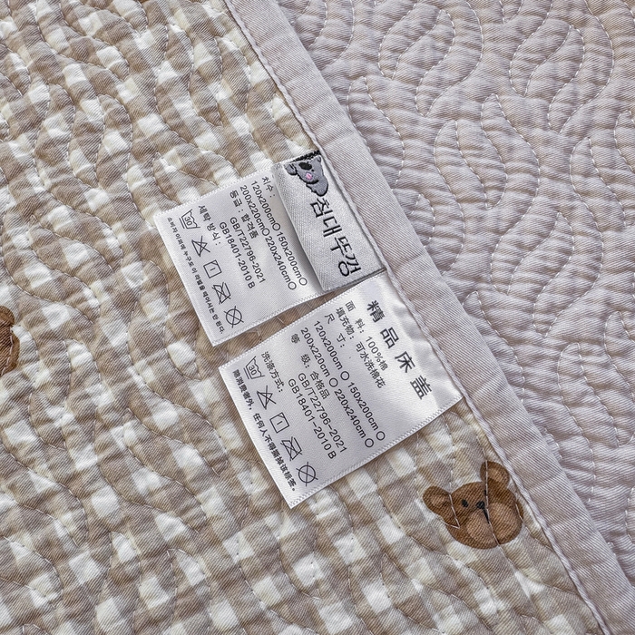 91家纺网 家纺一手货源 找家纺 宜梦家居【需要买家秀请联系老板】 2025新款双面纯棉夹层新疆棉花高温砂洗全棉床盖 呆萌熊咖