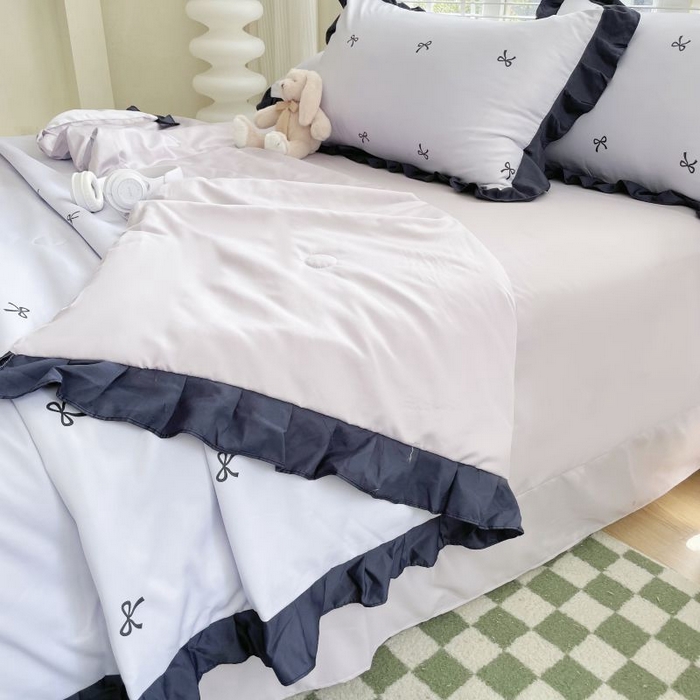 91家纺网 家纺一手货源 找家纺 绣女坊  2025新款水洗天丝夏被四件套 紫色蝴蝶结