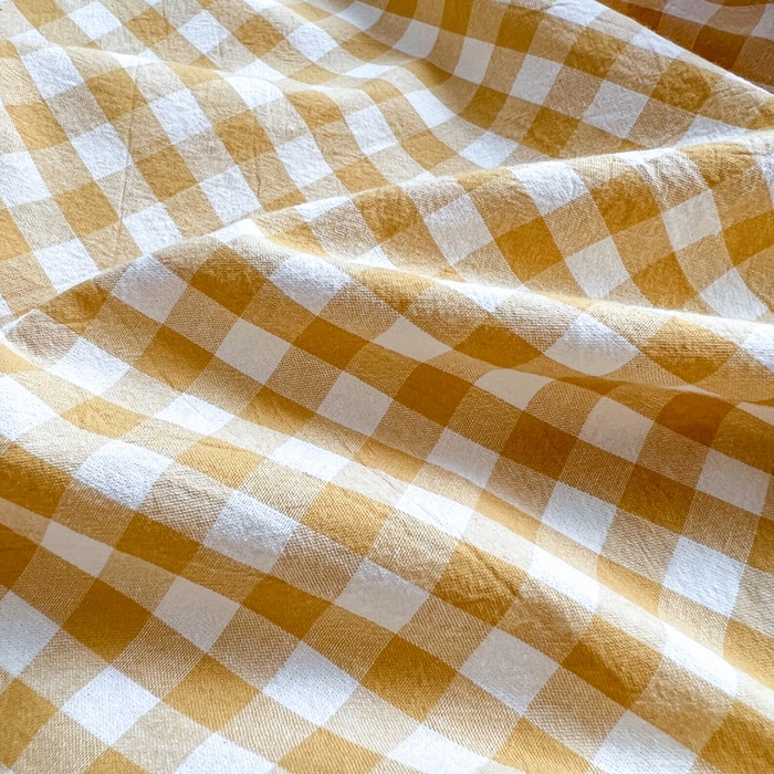 91家纺网 家纺一手货源 找家纺 2025新款水洗棉单床单 淡黄小格