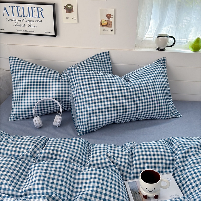 91家纺网 家纺一手货源 找家纺 可可家纺 2025新款印花卡通芦荟棉枕套亲肤信封式枕头套小清新 蓝小格