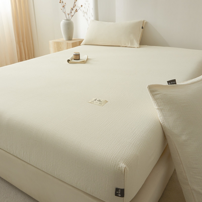 91家纺网 家纺一手货源 找家纺 鑫钰 2025新款纯色系列全棉双层皱皱纱床单-床笠 奶茶白-床笠