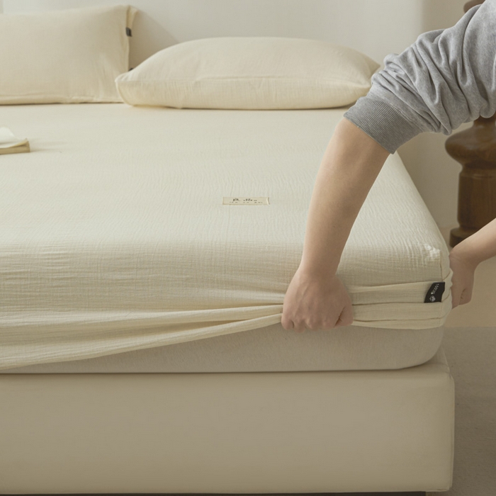 91家纺网 家纺一手货源 找家纺 鑫钰 2025新款纯色系列全棉双层皱皱纱床单-床笠 奶茶白-床笠