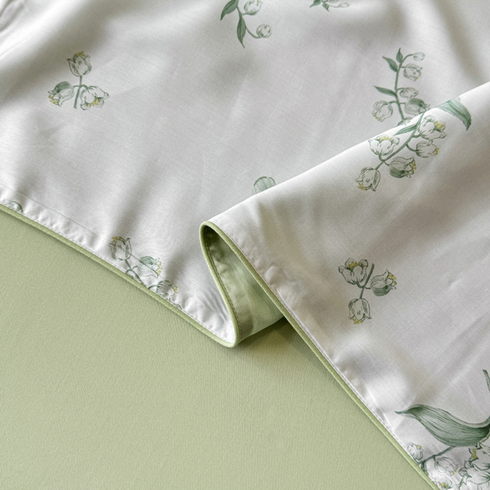 91家纺网 家纺一手货源 找家纺 芊寻家居 2025春夏新款50支莱赛尔天丝贡缎数码印花麻绳款四件套高端礼盒 铃兰花语绿