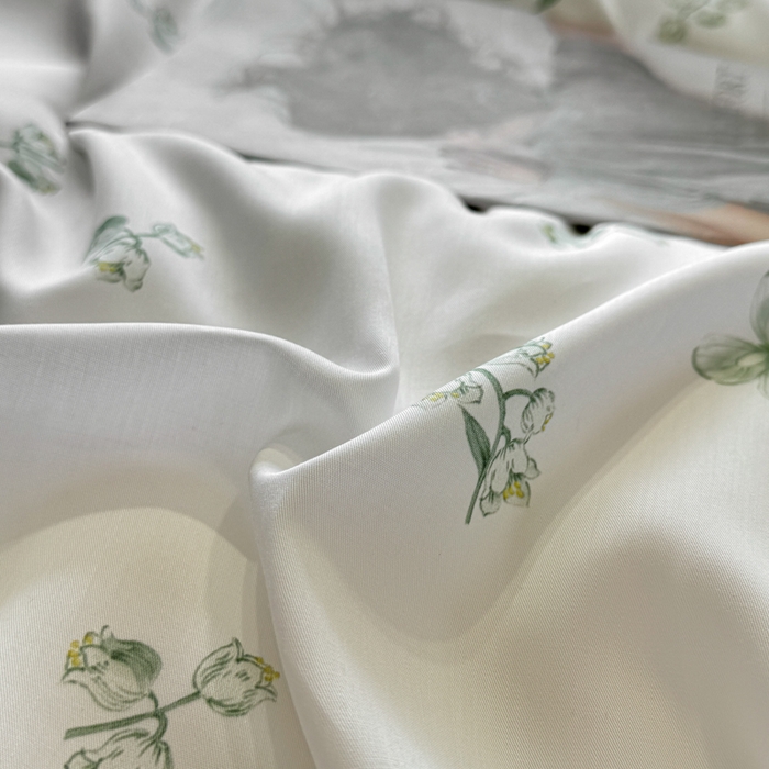 91家纺网 家纺一手货源 找家纺 洺兰家居 2025春夏新款100支莱赛尔天丝贡缎数码印花麻绳款四件套高端礼盒 铃兰花语绿