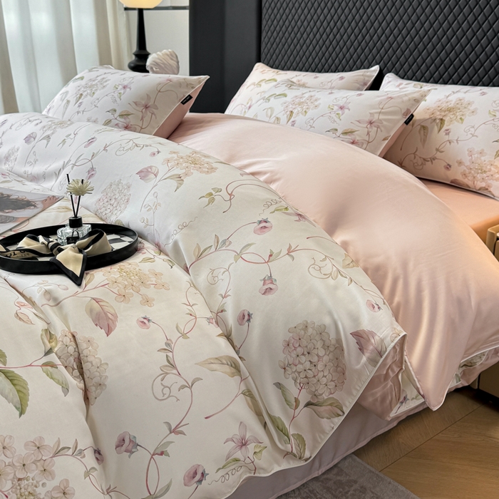 91家纺网 家纺一手货源 找家纺 洺兰家居 2025春夏新款100支莱赛尔天丝贡缎数码印花麻绳款四件套高端礼盒 绣球花语粉