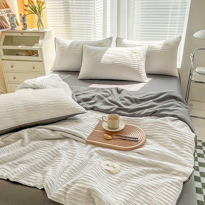 91家纺网 家纺一手货源 找家纺 斯卡诺家纺 2025新款直播爆款提花针织泡泡纱夏被四件套夏凉被空调被四件套 白灰色