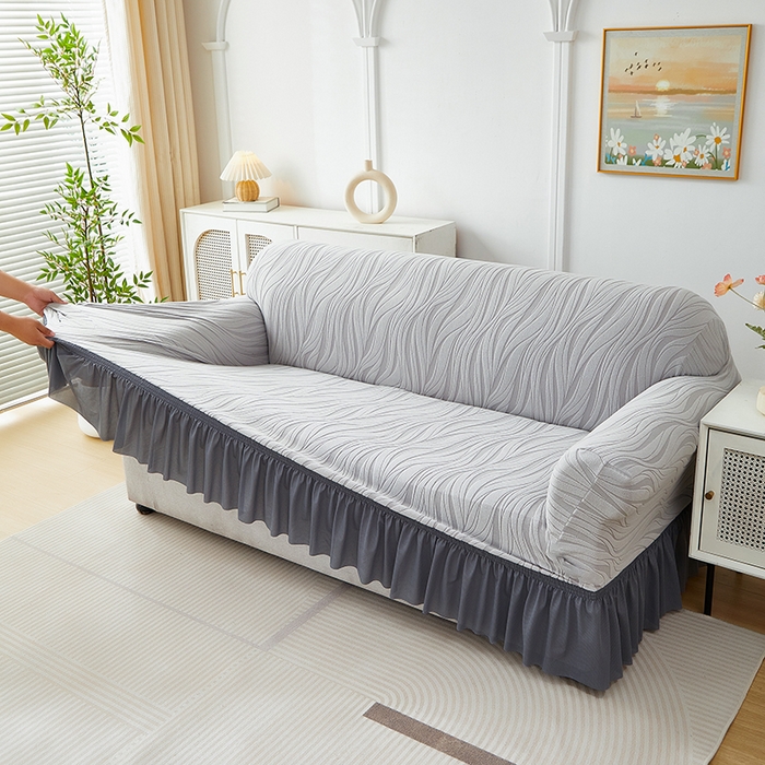 91家纺网 家纺一手货源 找家纺 共鸣沙发套 2025春夏新款水波纹裙摆弹力提花全包万能沙发套单沙发套裙摆款 浅灰色