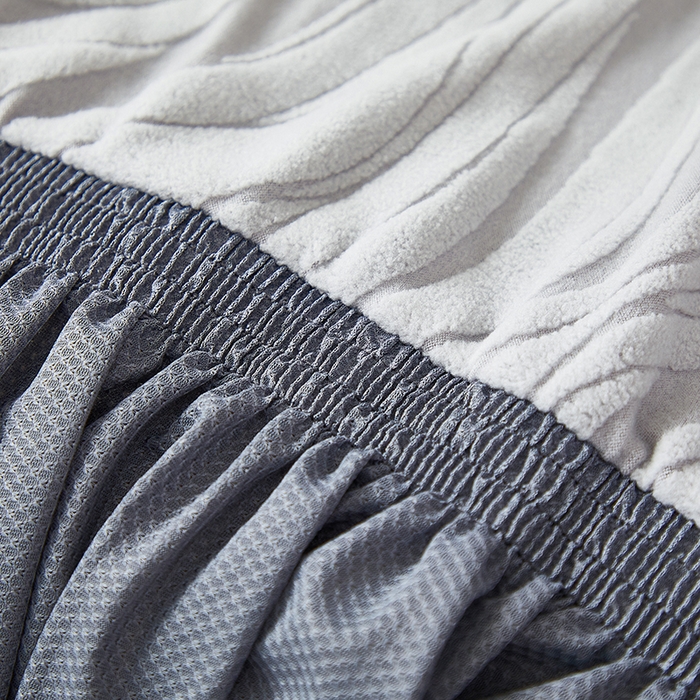 91家纺网 家纺一手货源 找家纺 共鸣沙发套 2025春夏新款水波纹裙摆弹力提花全包万能沙发套单沙发套裙摆款 浅灰色