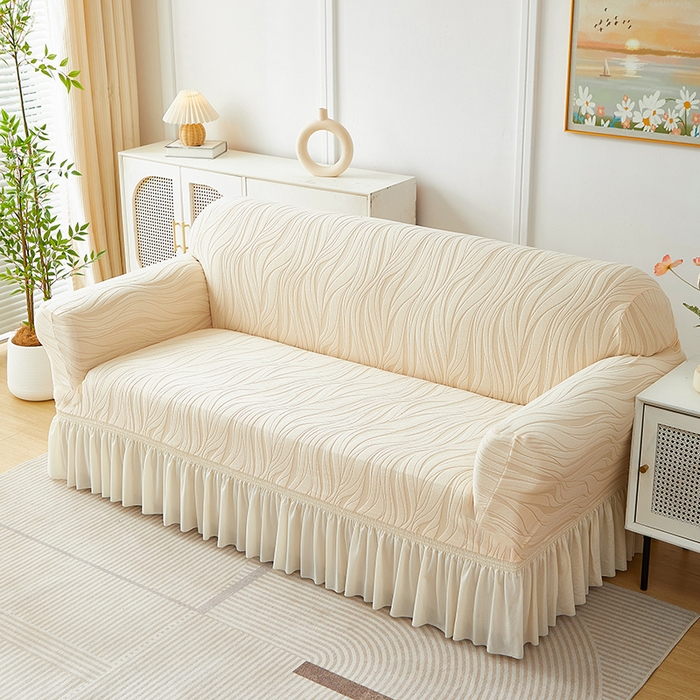 91家纺网 家纺一手货源 找家纺 共鸣沙发套 2025春夏新款水波纹裙摆弹力提花全包万能沙发套单沙发套裙摆款 米黄色
