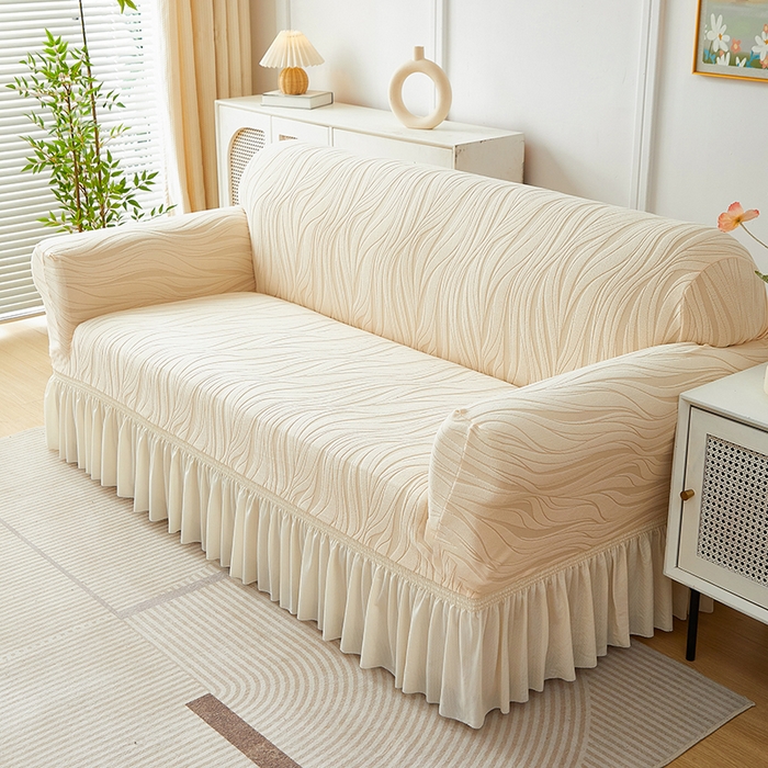 91家纺网 家纺一手货源 找家纺 共鸣沙发套 2025春夏新款水波纹裙摆弹力提花全包万能沙发套单沙发套裙摆款 米黄色