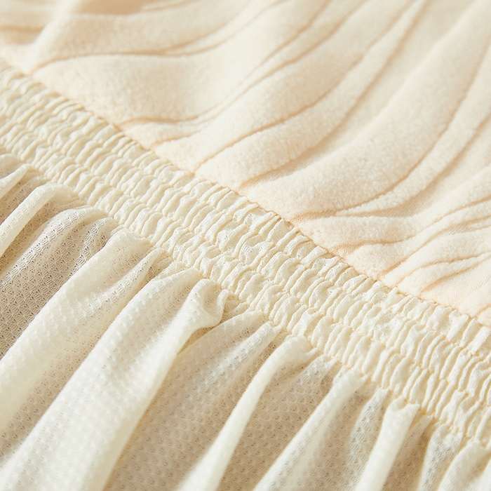 91家纺网 家纺一手货源 找家纺 共鸣沙发套 2025春夏新款水波纹裙摆弹力提花全包万能沙发套单沙发套裙摆款 米黄色