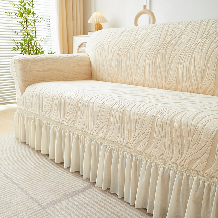 91家纺网 家纺一手货源 找家纺 共鸣沙发套 2025春夏新款水波纹裙摆弹力提花全包万能沙发套单沙发套裙摆款 米黄色