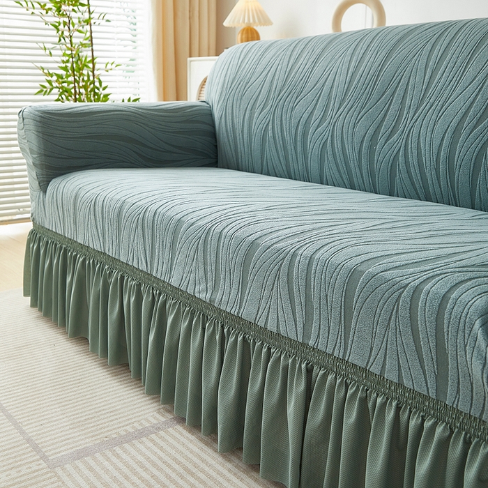 91家纺网 家纺一手货源 找家纺 共鸣沙发套 2025春夏新款水波纹裙摆弹力提花全包万能沙发套单沙发套裙摆款 墨绿色