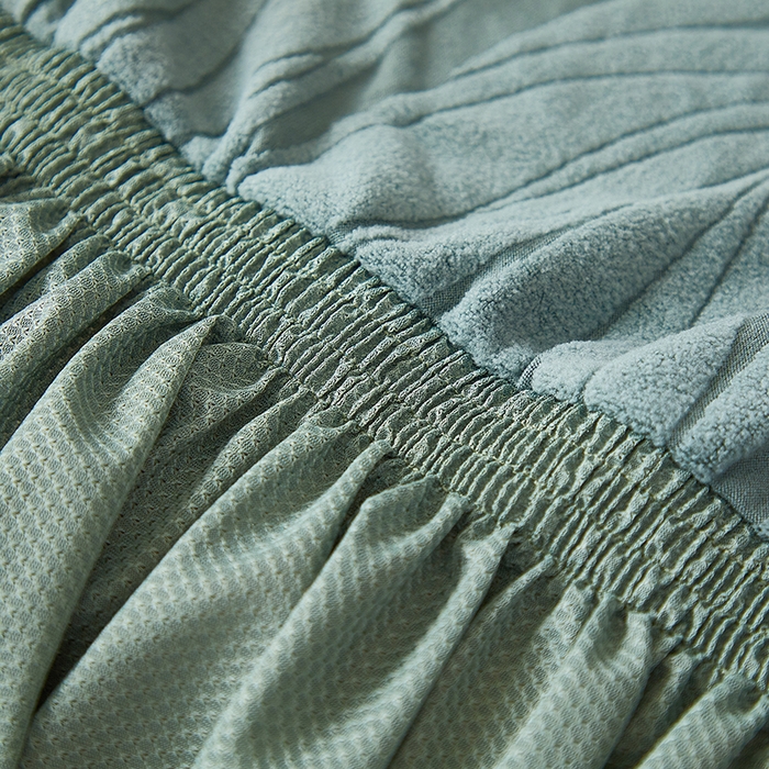 91家纺网 家纺一手货源 找家纺 共鸣沙发套 2025春夏新款水波纹裙摆弹力提花全包万能沙发套单沙发套裙摆款 墨绿色