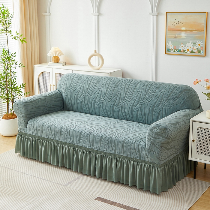 91家纺网 家纺一手货源 找家纺 共鸣沙发套 2025春夏新款水波纹裙摆弹力提花全包万能沙发套单沙发套裙摆款 墨绿色