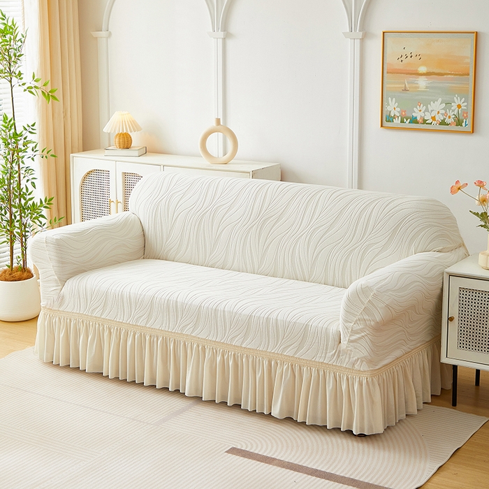 91家纺网 家纺一手货源 找家纺 共鸣沙发套 2025春夏新款水波纹裙摆弹力提花全包万能沙发套单沙发套裙摆款 象牙白