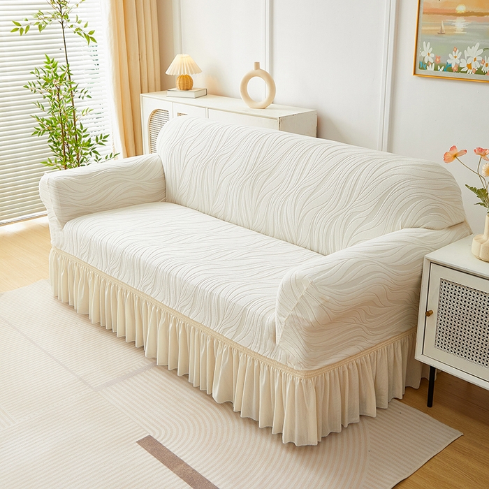 91家纺网 家纺一手货源 找家纺 共鸣沙发套 2025春夏新款水波纹裙摆弹力提花全包万能沙发套单沙发套裙摆款 象牙白