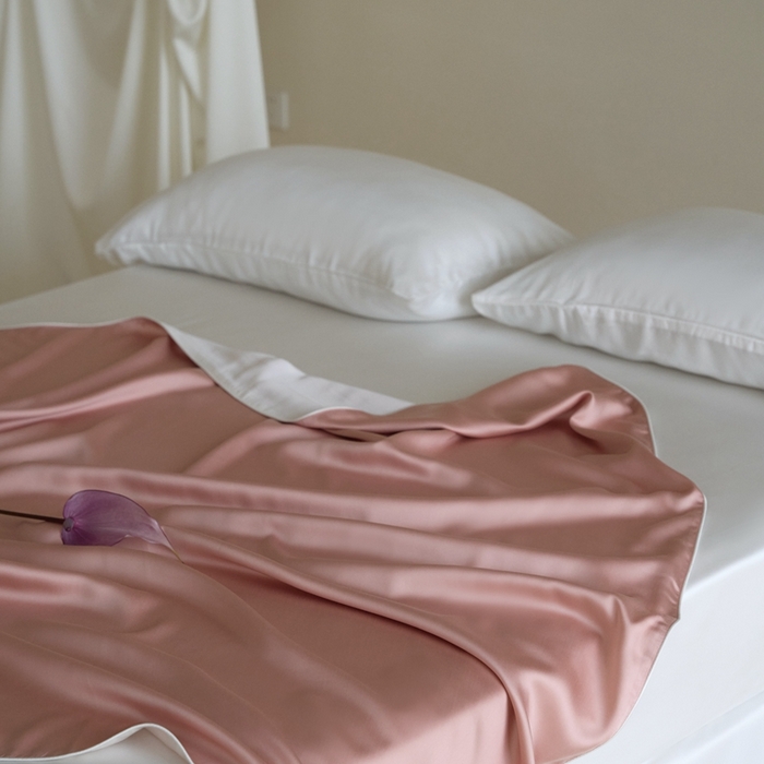 91家纺网 家纺一手货源 找家纺 沐晴家纺 2025新款60纯色兰精天丝休闲盖毯嵌绳工艺天丝毯-风格二 桃之夭夭