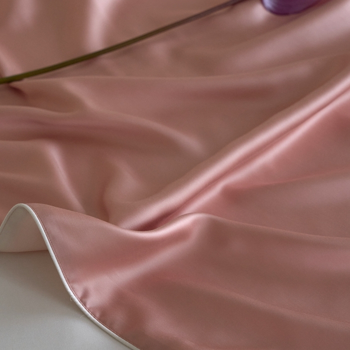 91家纺网 家纺一手货源 找家纺 沐晴家纺 2025新款60纯色兰精天丝休闲盖毯嵌绳工艺天丝毯-风格二 桃之夭夭