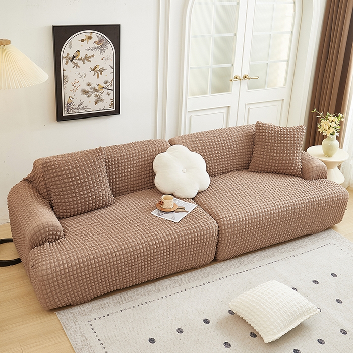 91家纺网 家纺一手货源 找家纺 丝绮鹿 2025新款泡泡爆米花系列—直排松紧款沙发套 驼色