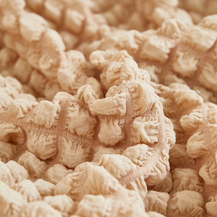 91家纺网 家纺一手货源 找家纺 丝绮鹿 2025新款泡泡爆米花系列—直排松紧款沙发套 米黄